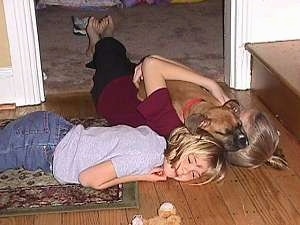 Amie, Brittany and Allie laying in a doorway together