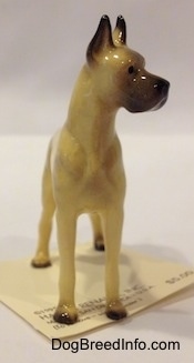 A tan with black Great Dane figurine.