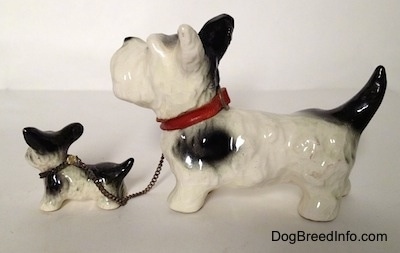 Vintage Goebel figurine set of an adult Miniature Schnauzer chained to its puppy