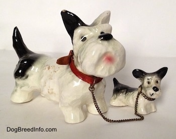 Vintage Goebel figurine set of an adult Miniature Schnauzer chained to its puppy