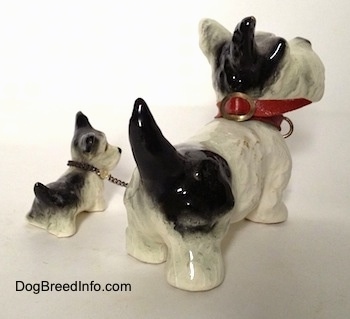 Vintage Goebel figurine set of an adult Miniature Schnauzer chained to its puppy