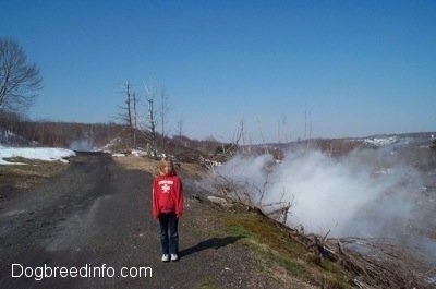 Amie standing next to the steaming ground