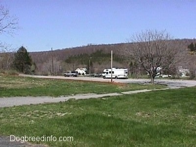 A Camper, A truck and the last houses on the other side of the road