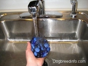 Fancy stones are being washed in a sink