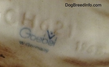 Close up - The underside of a Dachshund figurine that displays the Goebel W.Germany logo and it has engraved numbers on it. The letter/number combination is - CH621 and 1968.