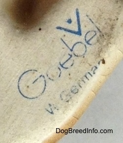 Close up - The underside of a figurine with the stamp of Goebel W.Germany stamped on it.