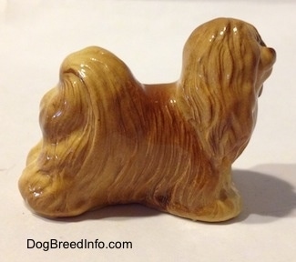 The right side of a brown figurine of a Lhasa Apso figurine.
