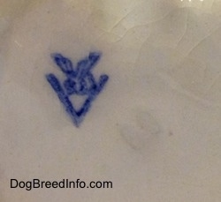 Close up - The underside of a Sealyham Terrier that has the full bee inside the v logo of Goebel W.Germany.